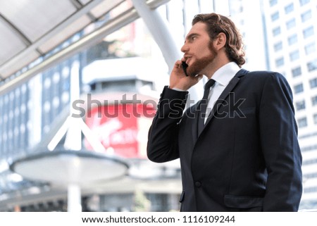 Businessman holding smartphone. Concept of business communication and technology.