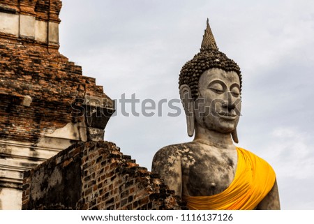 Buddha at Ayuttaya temple in Thailand. / Old buddha statue in Ayutthaya temple at Thailand.