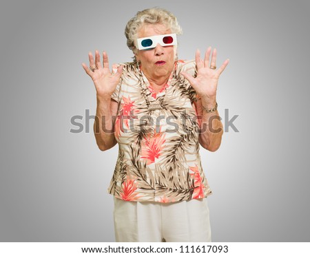 Portrait Of Senior Woman Wearing 3d Glasses Isolated Over Gray Background