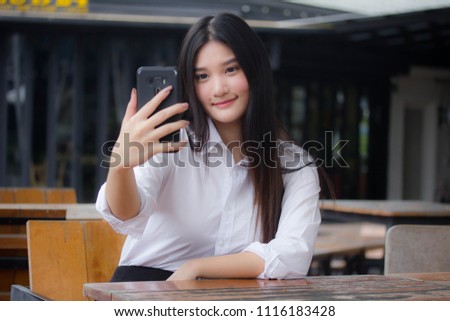 Portrait of thai adult office girl using her smart phone Selfie