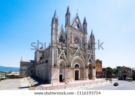 Exterior view of Orvieto Cathedral in the  cathedral square, a 14th-century Gothic cathedral in Orvieto, Italy Royalty-Free Stock Photo #1116193754
