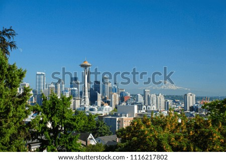Seattle Skyline background and trees in the foreground.
