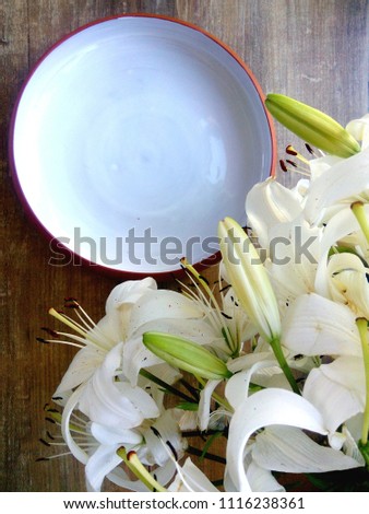 white plate and lilies