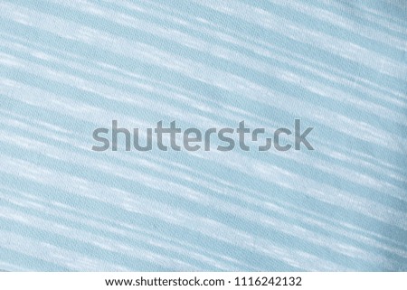 fabric knitwear on wooden background blue color