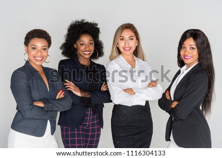 Group of businesswomen working together in an office Royalty-Free Stock Photo #1116304133