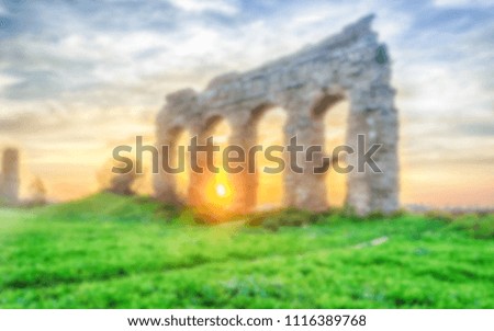 Defocused background with ruins of ancient Roman Aqueducts, Rome, Italy. Intentionally blurred post production for bokeh effect