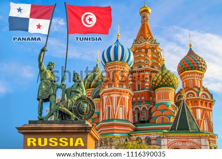 Flags of Korea Panama and Tunisia being held by two warriors on a statue in front of a Saint Basil's Cathedral in Moscow, Russia