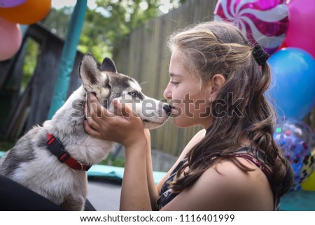 teenager girl with husky close up photo on outdoor summer background