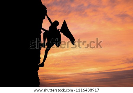 A silhouette of man climbing on mountain top over sunset background, Business, success, leadership, achievement, attempt, patient, endeavor and people concept. Royalty-Free Stock Photo #1116438917