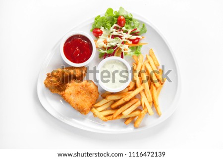 Fish and chips with french fried, salad, ketchup and dipping sauce on white background