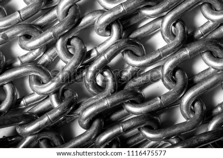 Texture, pattern. solid anodized chain. A number of metal bonds, one to the other. linked flexible series of metal links used for fastening or securing objects and pulling or supporting loads.