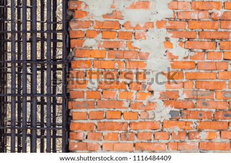 Texture, background, pattern. An old brick wall. Abandoned building. Traditionally, the term "brick" refers to a unit consisting of clay - a building material used to make walls