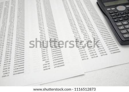 printout paper with calc on desk