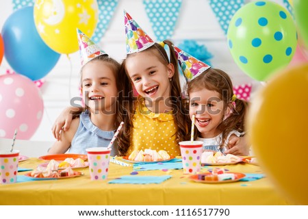 children's birthday. happy kids with cake and ballons
