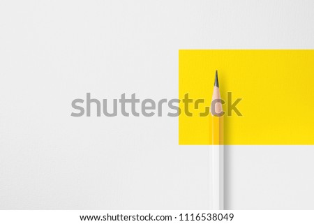 Minimalist presentation template with copy space by close up photo of yellow pencil isolated on white paper and combine with yellow rectangle shape. Flashlight made smooth lighting on yellow pencil. Royalty-Free Stock Photo #1116538049