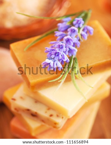 Photo of different color soap and purple lavender flower, image of natural organic cosmetics for shower, picture of handmade soap bar, beauty treatment, skincare concept, homemade hygiene