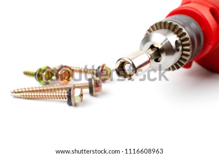Close up HEX Drive magnetic drill bit socket driver (8mm) for roof screw install with red electric drill isolated on white background.