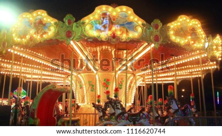 blur picture of carousel in amusement park