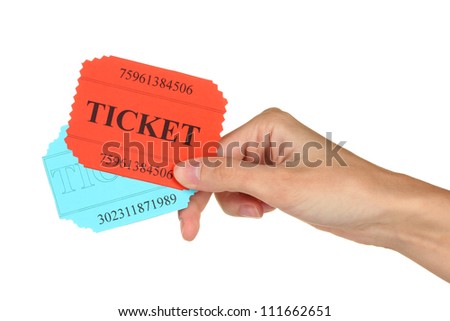 Woman's hand holding a colorful tickets on white background close-up