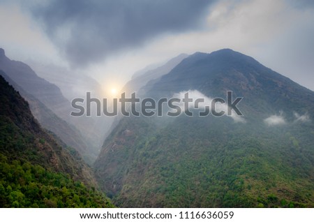 Mountain valley with many hills in a fog in Annapurna range, Nepal Himalayas. travel concept and camping.