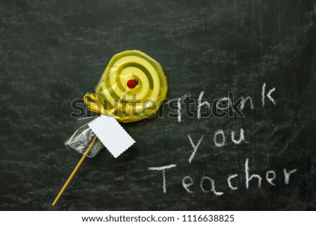Thank you note to the teacher with lollipop, on the black board