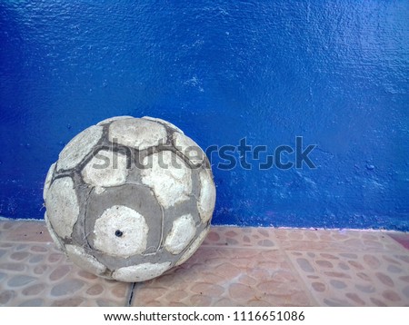 The soccer ball is used to peel off the skin.