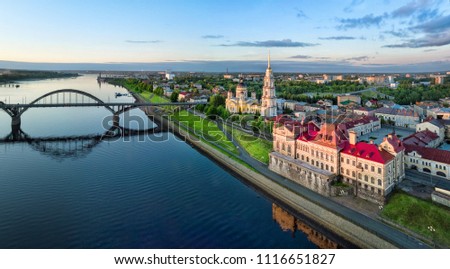 Aerial cityscape of Rybinsk: Volga river embankment, cathedral and bridge Royalty-Free Stock Photo #1116651827