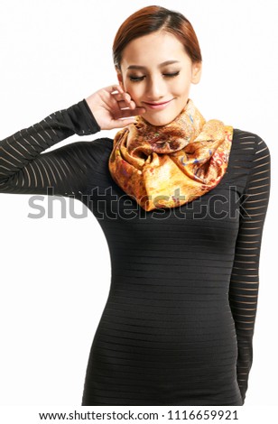 Happy Asian girl wearing yellow scarf in white background