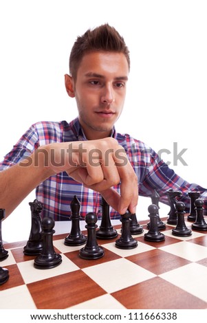 Young casual man preparing to make his first move. Isolated on white background.