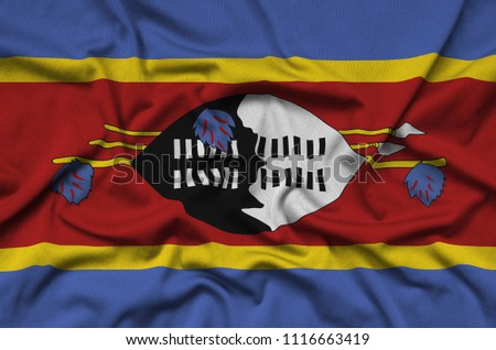 Swaziland flag  is depicted on a sports cloth fabric with many folds. Sport team banner