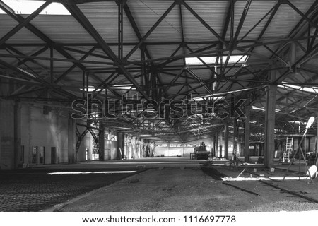 the interior of a large industrial building in the process of construction black and white photo