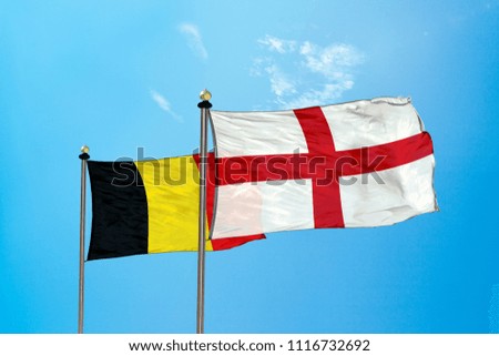 England and Belgium flag on the mast