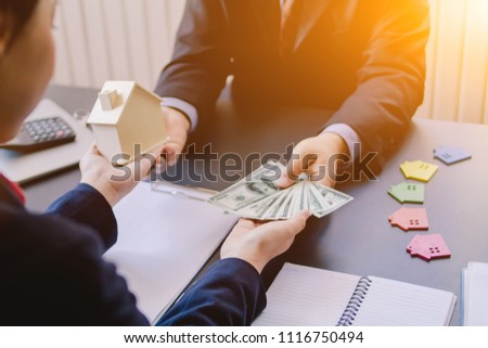 Soft Focus,Two businesspeople are discussing in the office in the morning at a window-based business desk and a male businessman has invited a businesswoman to join in a sought-after estate.