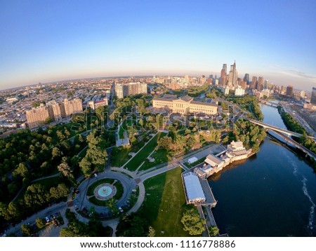 Evening Aerial View With Evening Sun Light Hitting The Building of The Philadelphia City Skyline From Perspective of Schuylkill River - Pennsylvania