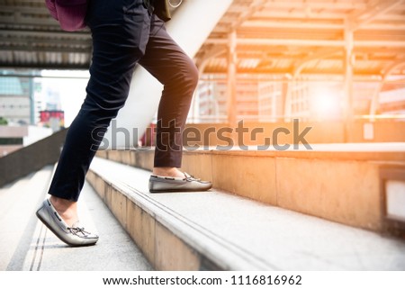 Close up of woman legs walking up stair in the city. Business and people concept. Try and succeed theme. Royalty-Free Stock Photo #1116816962