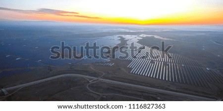 Industrial aerial sunrise solar photovoltaic base