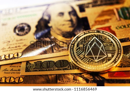 Golden EOS.IO and US dollar banknote. Digital cryptocurrency concept