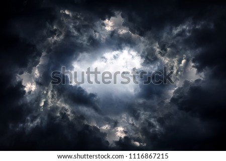 Tunnel in the Dark and Dramatic Clouds Royalty-Free Stock Photo #1116867215