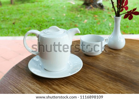 tea cup and tea pot on the table
