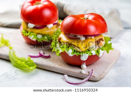 Low carb burger option - tomato burger Royalty-Free Stock Photo #1116950324