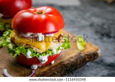 Low carb burger option - tomato burger Royalty-Free Stock Photo #1116950348