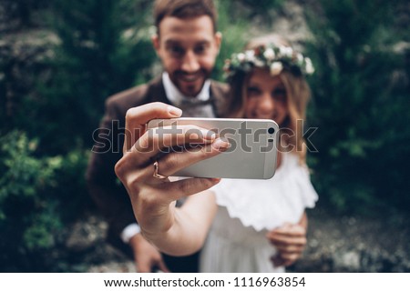 Wedding couple making selfie