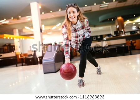 Beautiful woman bowling