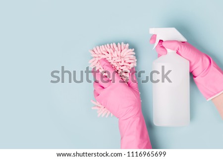 Female hands cleaning on blue background. Cleaning or housekeeping concept background. Copy space.  Flat lay, Top view. Royalty-Free Stock Photo #1116965699
