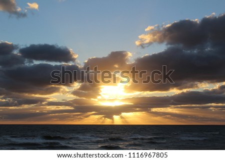 Beautiful blue sky Sunset at the beach with puffy clouds and ocean view 