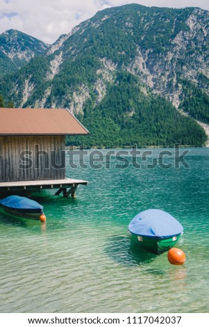 Marina and boat house, Lake Plansee near Reutte, Austrian Alps. Austria.
