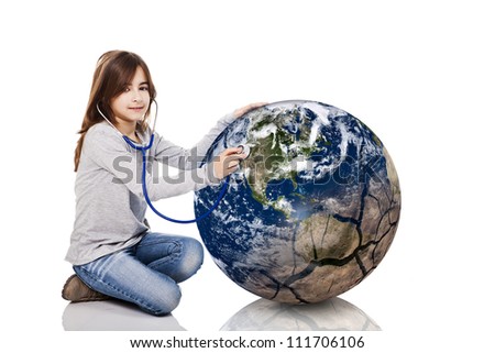 Portrait of a little girl auscultate the health of the planet earth with a stethoscope, isolated on white background