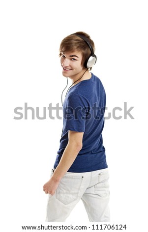 Portrait of a handsome young man listen music with headphones, isolated on white background