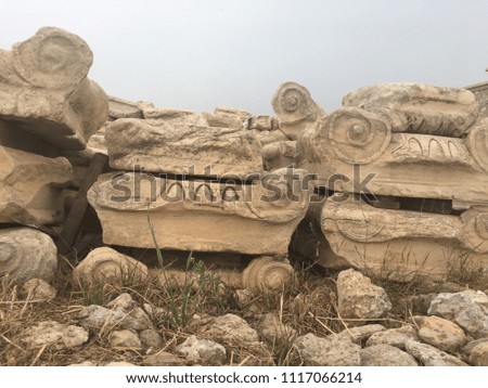 Pile of ruined column capitals at the Acropolis in Athens Greece