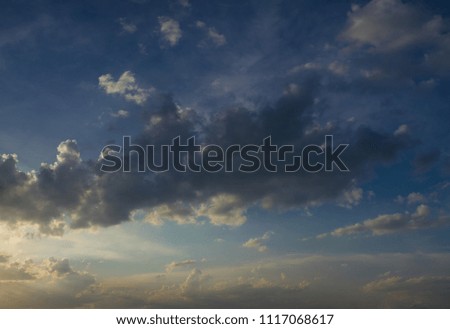 Background for design, sky texture with gray clouds at sunset or sunrise
